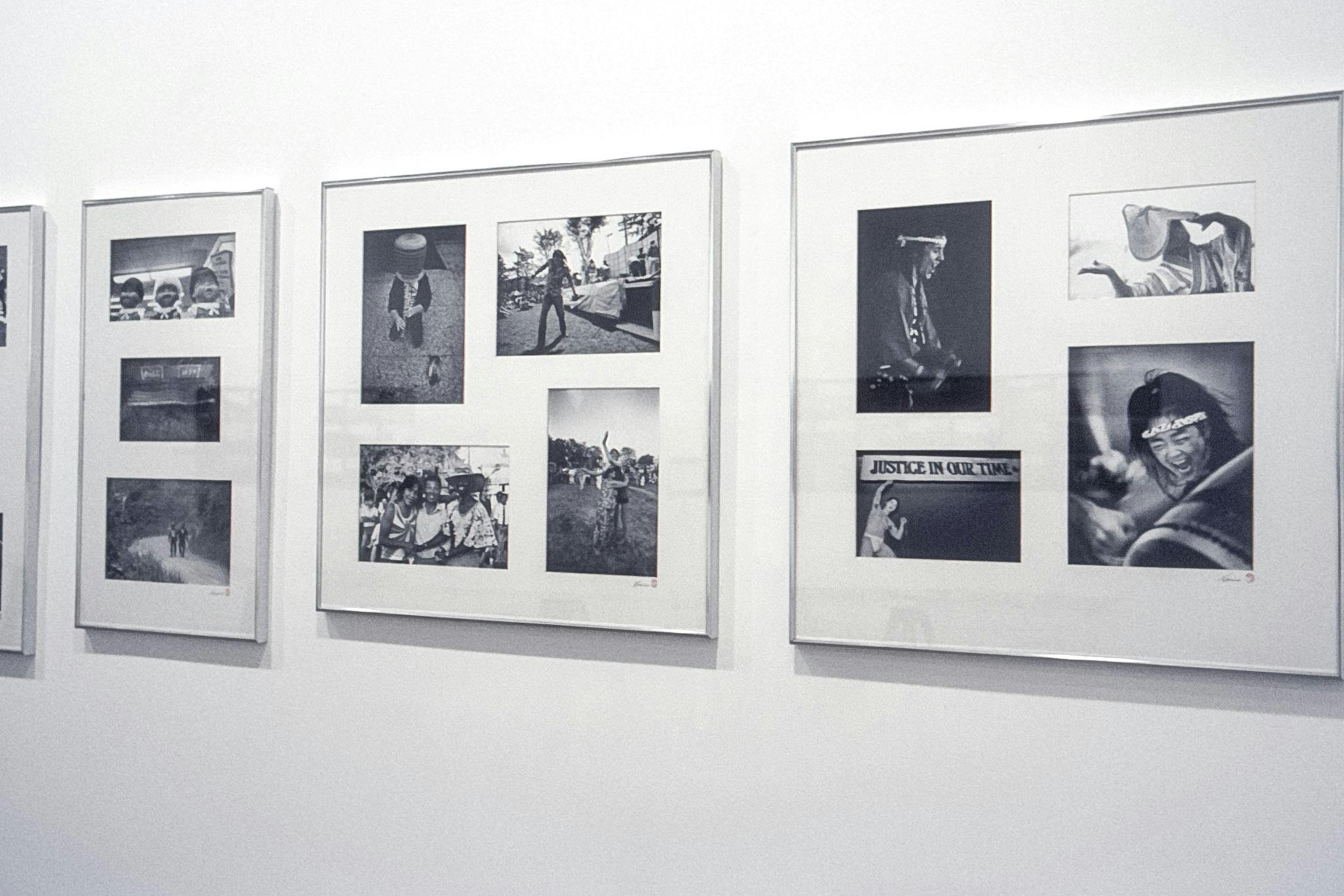 A closeup of 4 different metal frames with black and white in them. The frames and photos both vary in size, and they show different festivities. One frame has 4 photos of a taiko drumming ceremony.