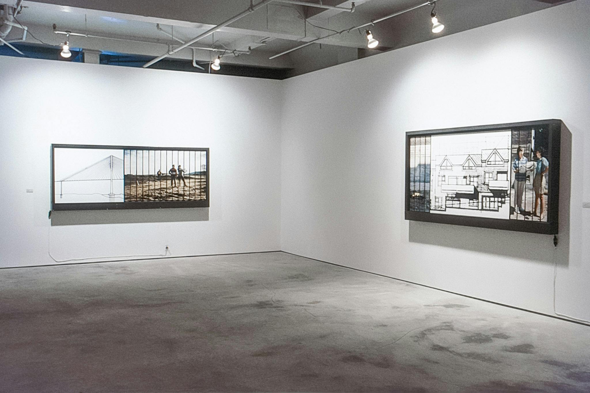 Two artworks on the walls of a gallery. One shows a drawing of a bridge, and a fragmented image of people in a field. One has an exterior drawing of houses, and two fragmented photos of a city scene.