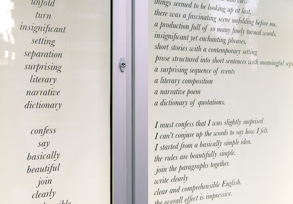 Detail image of Meriç Algün Ringborg’s text-based artwork installed in the CAG’s exterior window spaces. A part of the text lists English words such as setting, separation, and surprising.